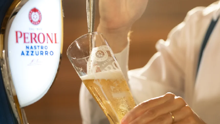 Pint of Peroni Nastro Azzurro being poured